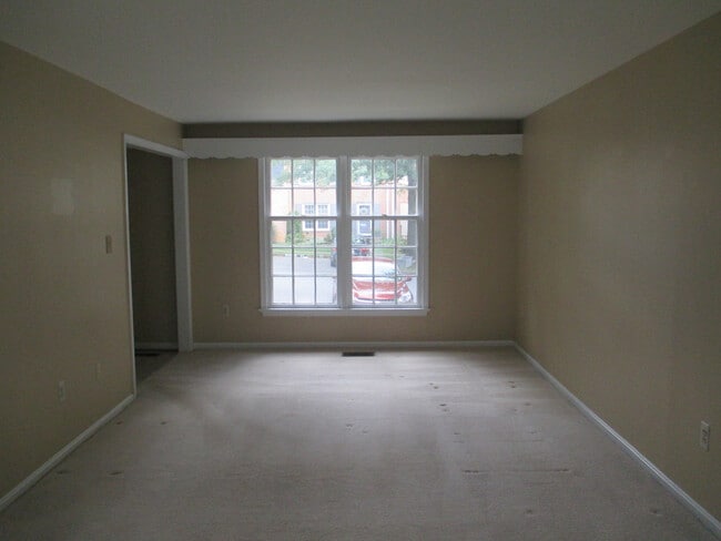 Building Photo - SPACIOUS BRICK TOWN-HOME