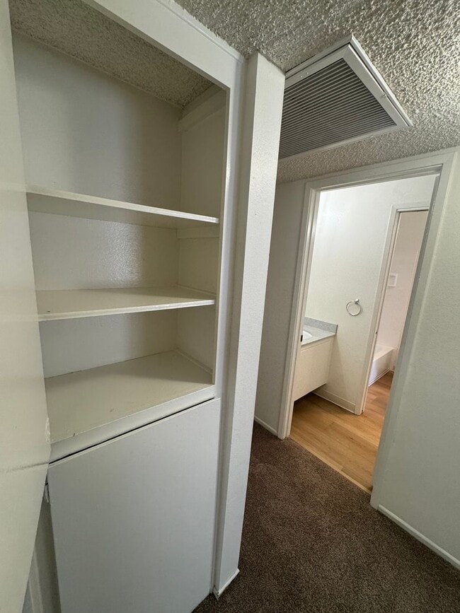 Building Photo - Upstairs two-bedroom 1/12 bath condo avail...