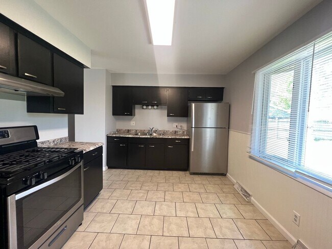 Building Photo - Spacious 4-Bedroom Home with Finished Basement & Attached Garage