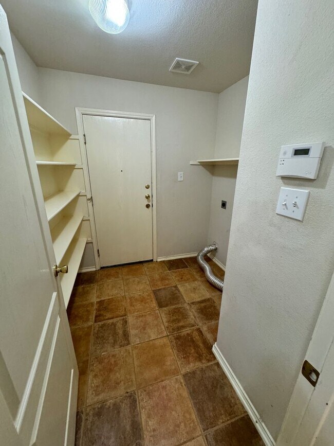 Building Photo - Ready For Move In! A Must See in Rogers Ranch - 4 Bedroom 2 Bath with Custom Features