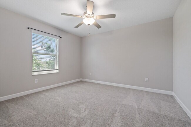 Building Photo - "Spacious 4-Bed Oasis with Granite Charm in Lutz!"In a gated community with 2 Cars garage