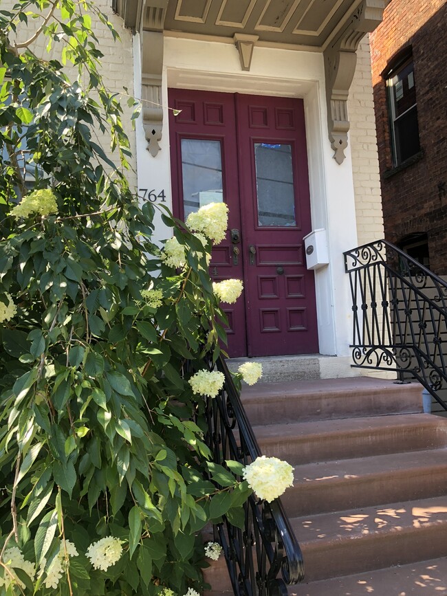 Front porch with secure lobby. Wrought iron. - 764 Eastern Ave