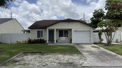 Building Photo - Charming 3BR/2BA Home in Boca Heights with Spacious Fenced Yard