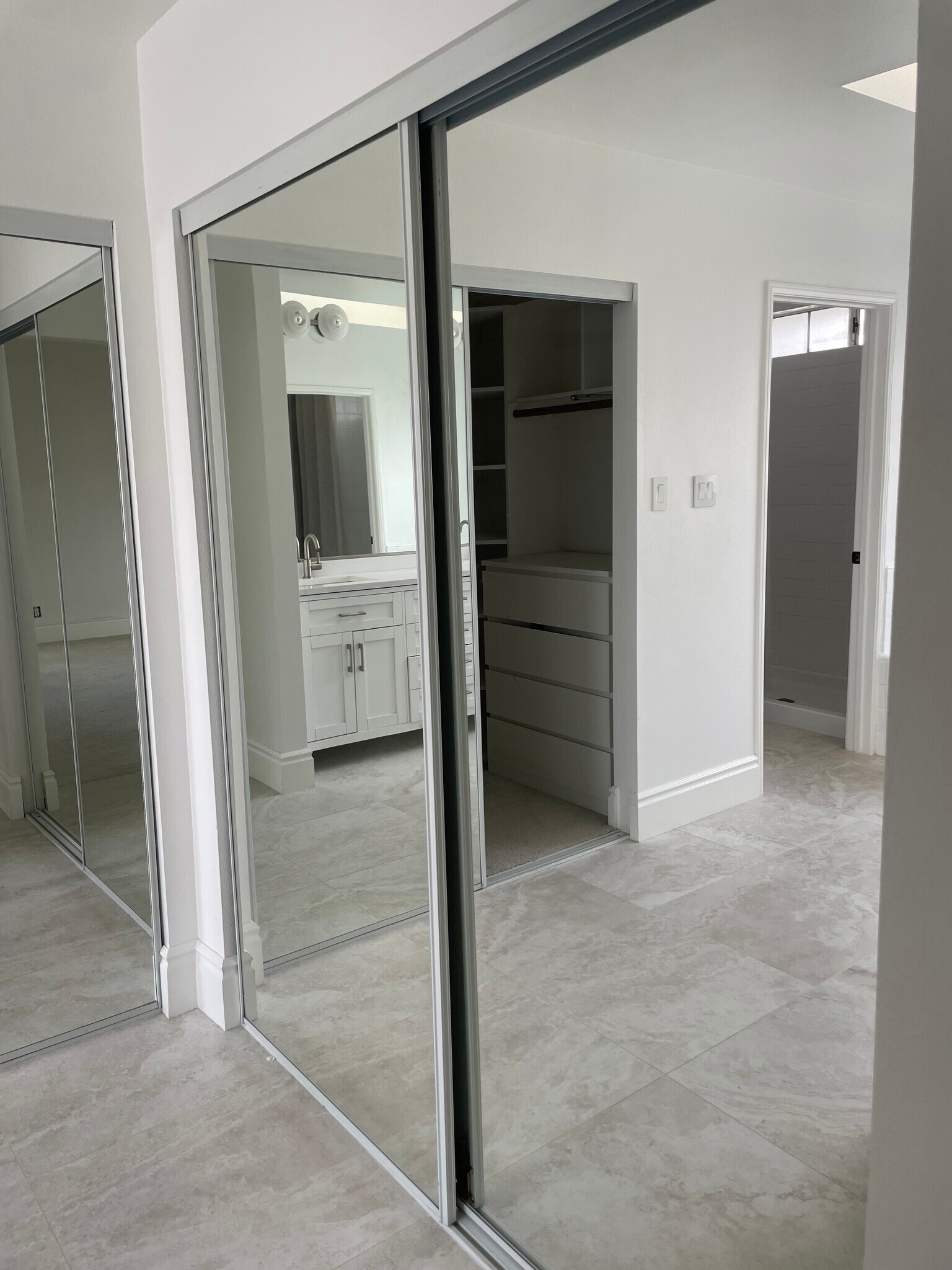 Sliding mirrored doors expand space - 2220 Curtis Ave