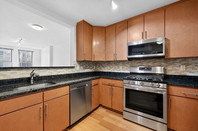 Building Photo - Penn Quarter 1BR Condo with Balcony, Garage Parking, Storage, Concierge, and Rooftop Deck.
