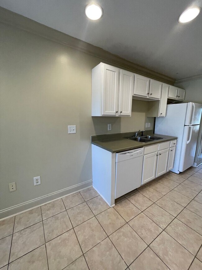 Building Photo - Two Bedrooms Available in this Three Bedroom Flat, Female Applicants!