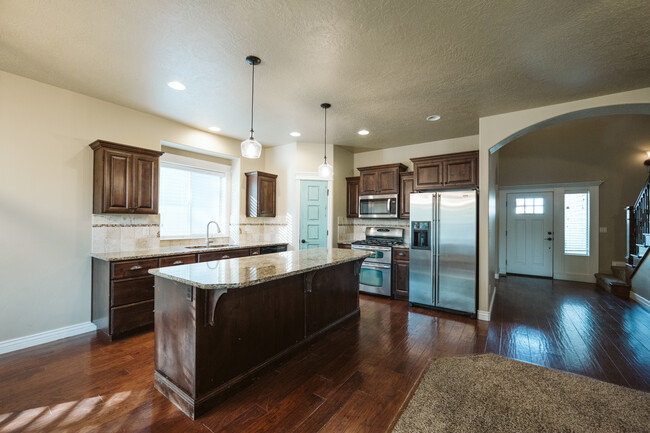 Open kitchen looking into living room. - 2778 S Blackspur Way