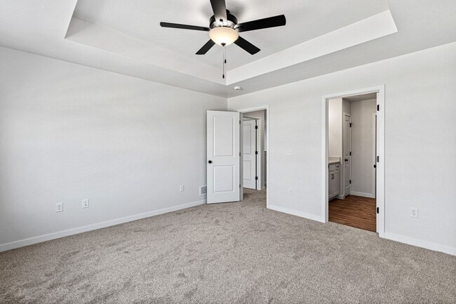 Building Photo - New 3 Bed Townhome with Covered Deck and Oversized Garage!