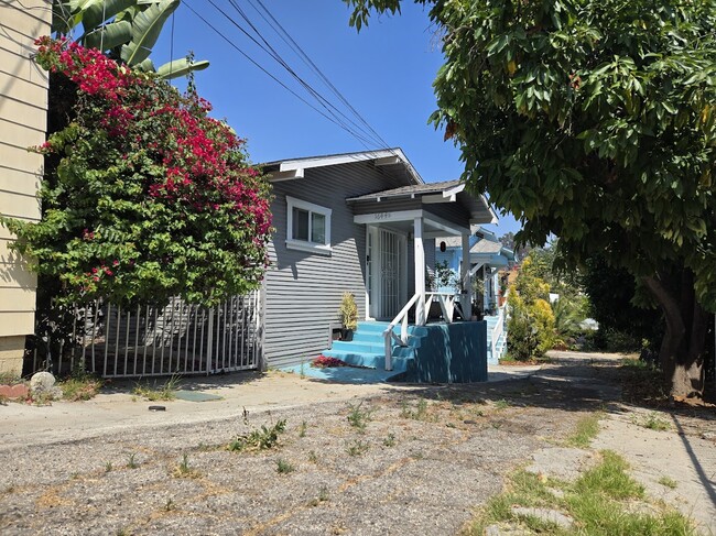 View of middle house, rental is farthest back in photo on right - 1644 Mohawk St