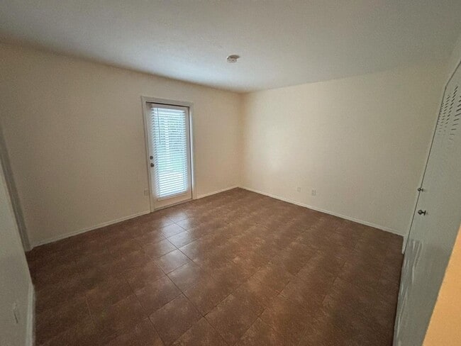 Building Photo - 2/2/1 home with a spacious fenced backyard...