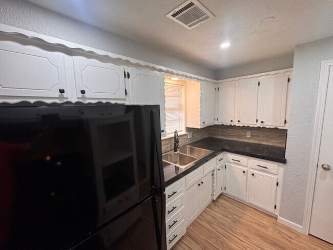 Building Photo - Newly remodeled 3 bed 1 bath garage conversion with monitored security!