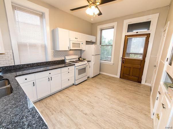Large Kitchen with all white appliances and subway tile - 4507 S Grand Blvd