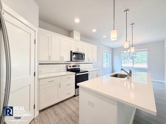 Building Photo - Easy JBLM Commute Like-New 4BR Home with 3-Car Garage & Bonus Office