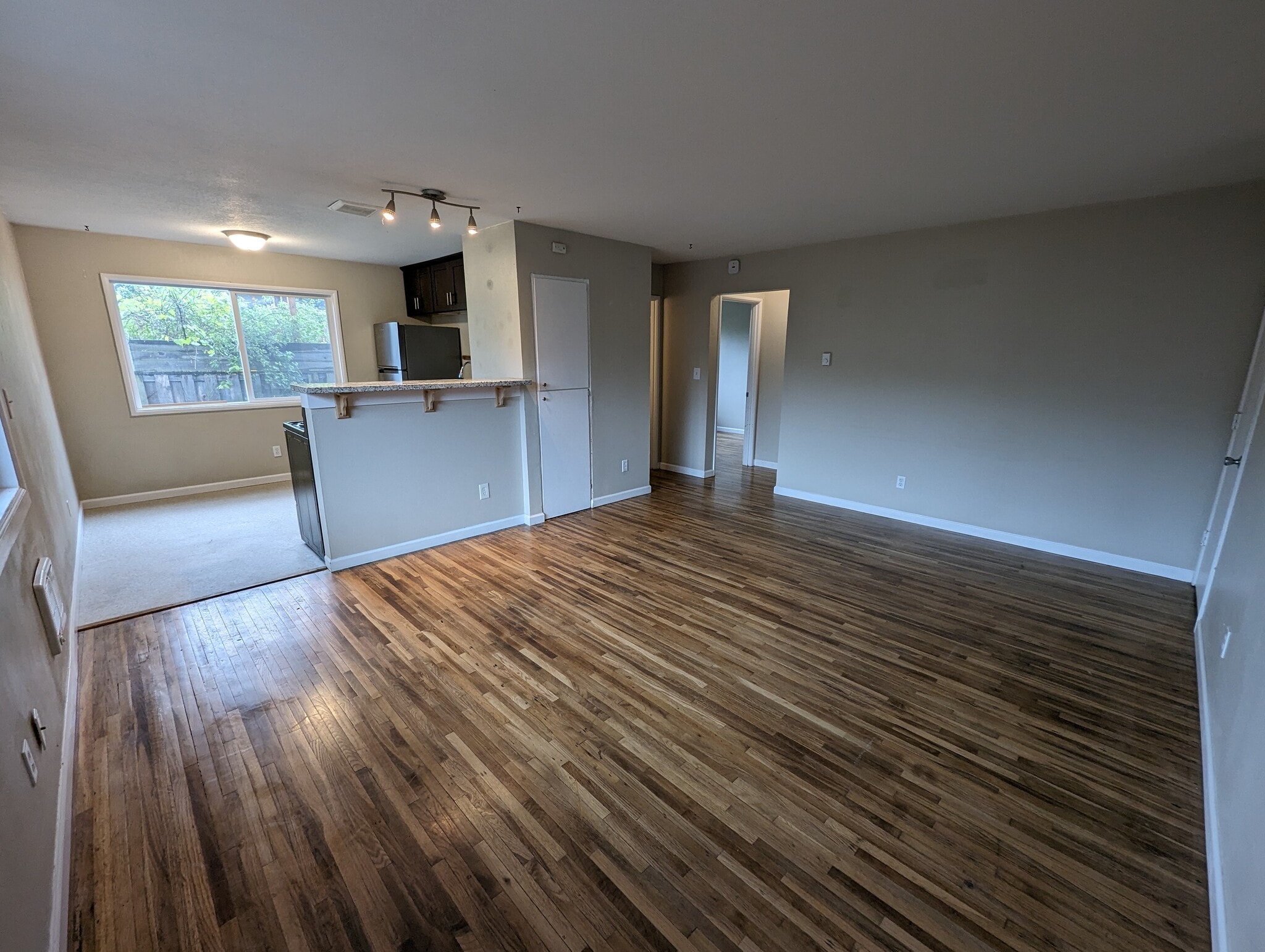 counter car separates kitchen and living room - 1626 Southeast Lexington Street