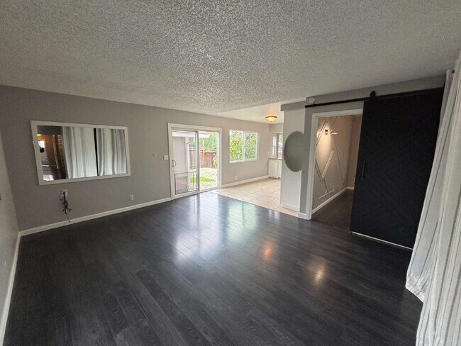 Building Photo - "Charming Concord Retreat: 3-Bedroom Gem with Granite Accents & Cozy Fireplace"