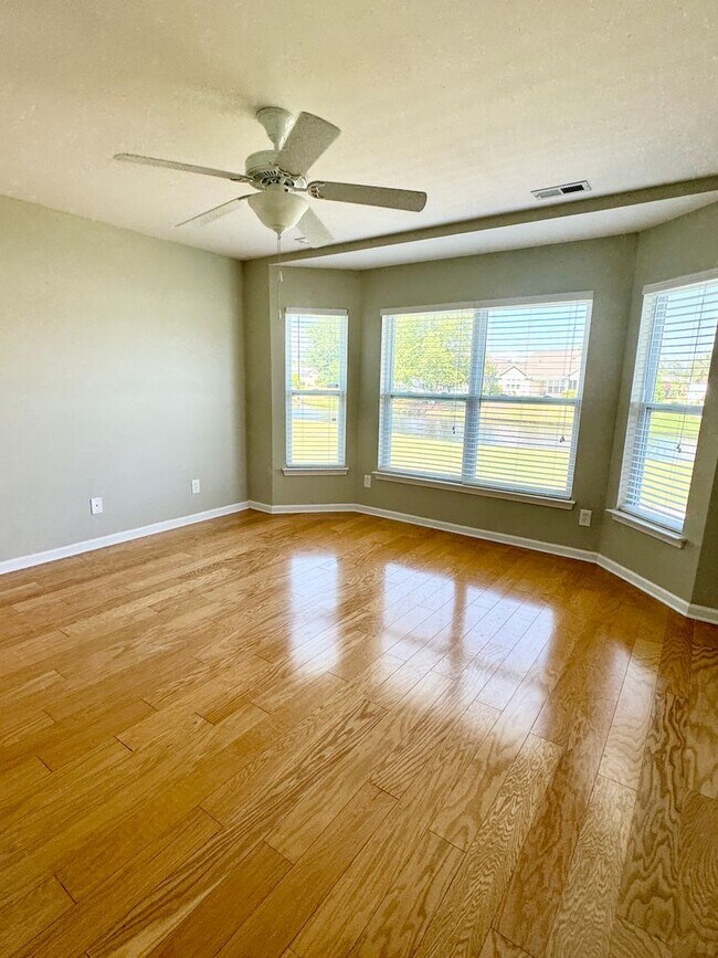 Building Photo - Like New 3 Bedroom & 2 Bath pond front home in Hillsborough! Enjoy the Community Pool, Playground...