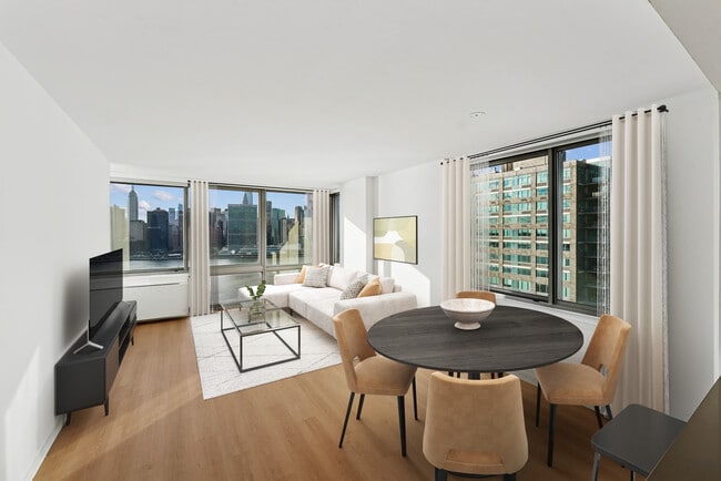 Renovated Package I dining and living room with hard-surface flooring - Avalon Riverview