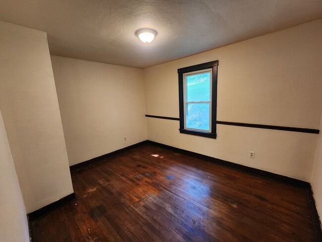 Building Photo - 4 BR home with first-floor living, new roof, and a private-feeling backyard in Lincoln Place