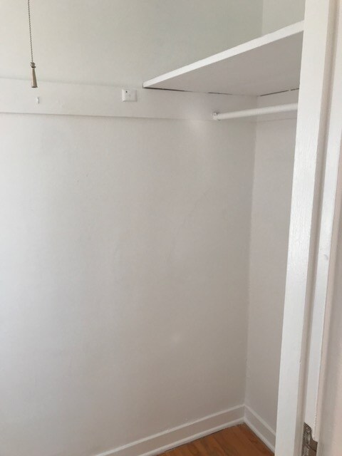 Partial View of Walk In Bedroom Closet - 918 1/2 S Orange Grove Ave