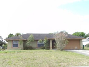 Building Photo - OPEN FLOOR PLAN 3 BEDROOM 2 BATH 2 CAR GARAGE