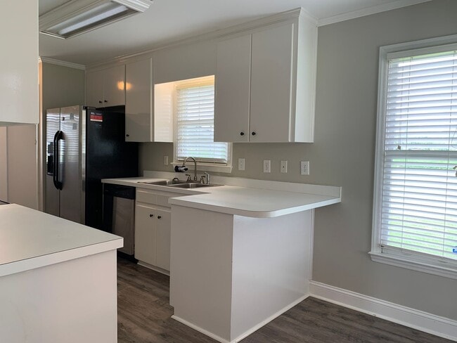 Building Photo - Pretty Home, Featuring 1st Floor Master Su...