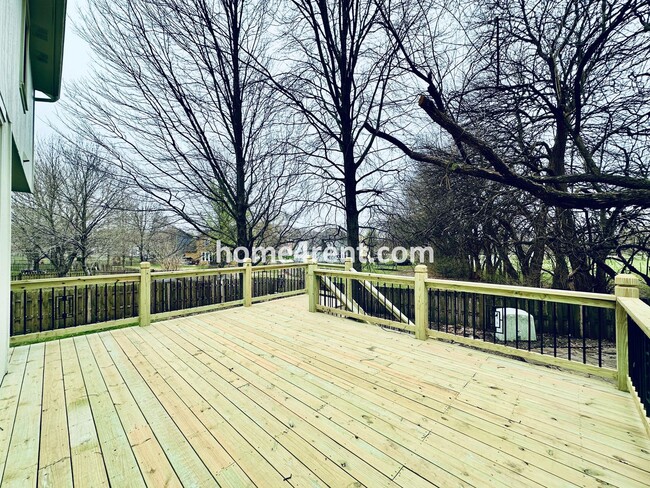 Building Photo - Blue Valley Schools w/ Wood Floors, Finished Basement and a Peaceful, Private Fenced Yard!