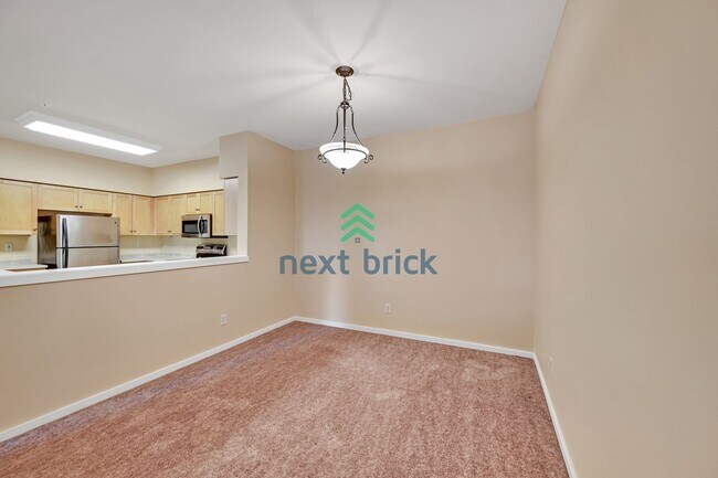 Building Photo - Rare Ground-Floor, End Unit with massive b...