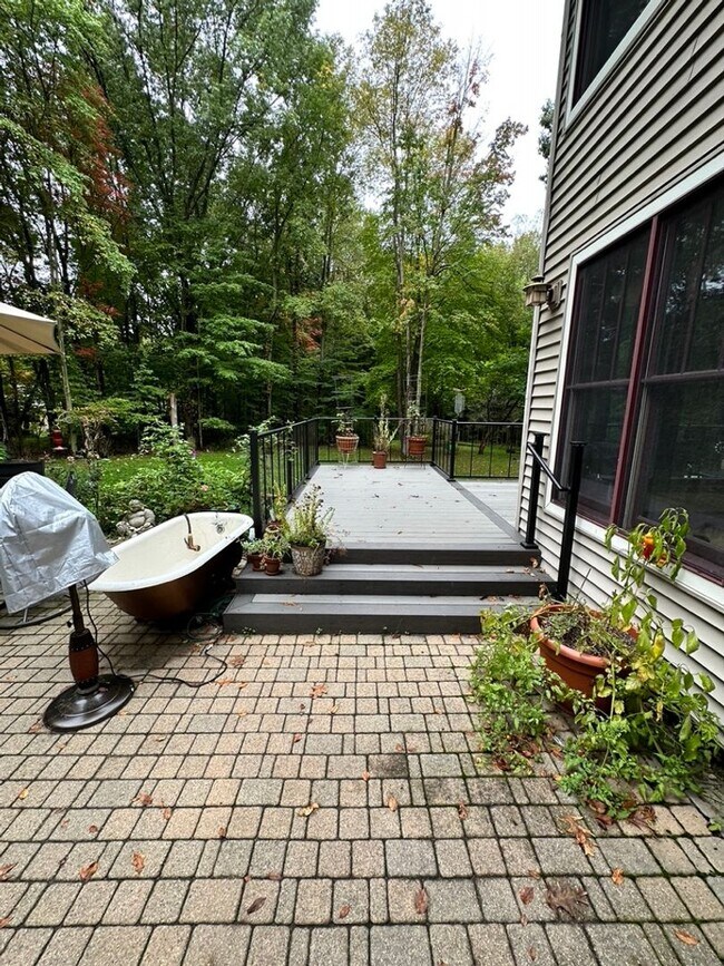 Building Photo - Dream Home in Highland, Michigan: Your Private Oasis on 5 Wooded Acres