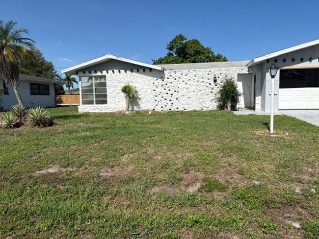 Building Photo - ****TWO WEEK FREE**** Charming 2-Bedroom Ranch in Cape Coral’s Bimini Basin Neighborhood