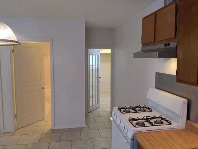 kitchen looking into the storage and bathroom - 403 Ellana Claire St