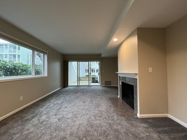 Building Photo - Ground Floor End Unit on Jantzen Beach with River Views & Flexible Living Space