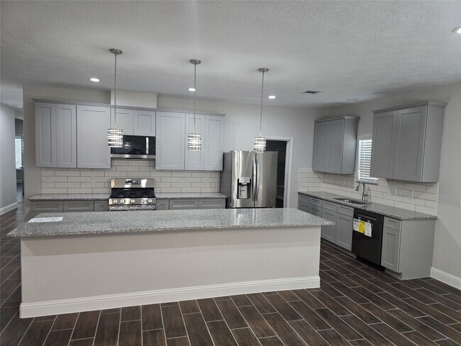 Building Photo - 213 E Adoue Ave