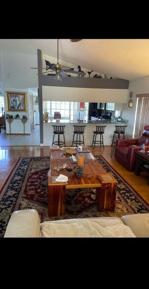 Living room view looking towards the kitchen and Island which has lowlights - 7639 Wells Ct