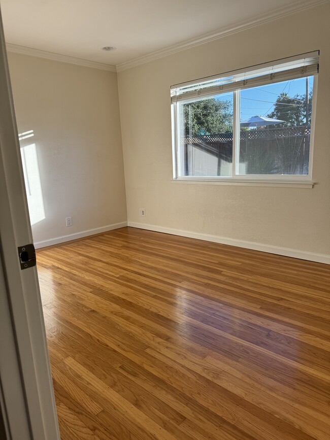 Bedroom 1 overlooking backyard - 1533 Santa Monica Ave