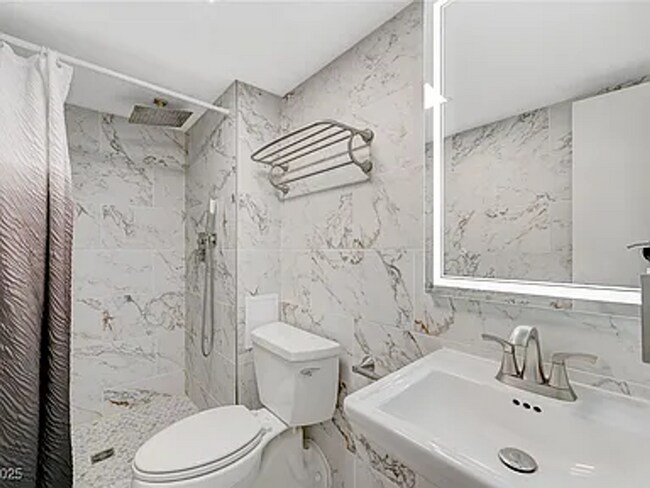 Building Photo - Enjoy resort-style living in this 2 Bed 2 Bath Condo with Stunning Strip Views in the Wimbledon C...