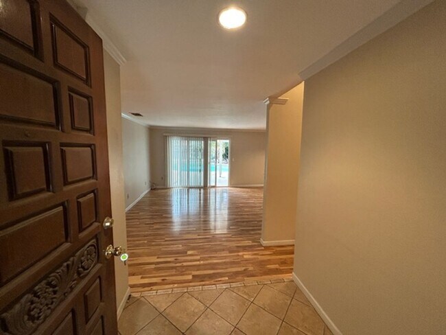 Building Photo - SW 3 Bedroom 2 Bath home with Pool. Yard Care Included.