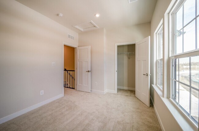 Building Photo - This 3-bedroom, 3-full bathroom townhouse offers a pristine and contemporary living experience.