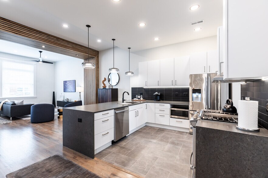 European kitchen cabinets, waterfall quartz, cool tiles, high end appliances. - 795 E McMillan St