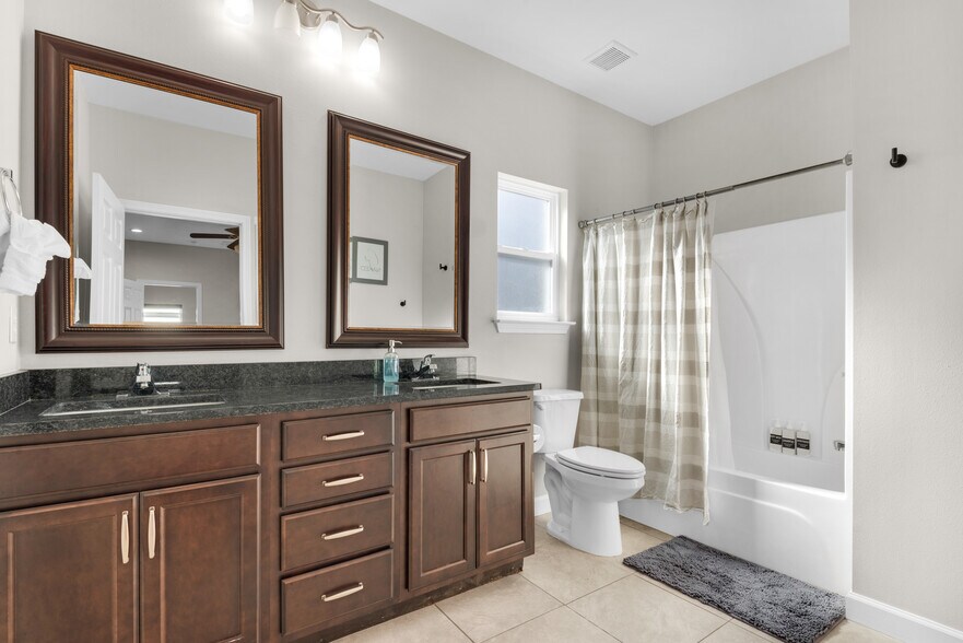 Master bathroom with his & her sinks, fresh towels, hair dryer, soap, shampoo, and conditioner - 28 Snook Rd