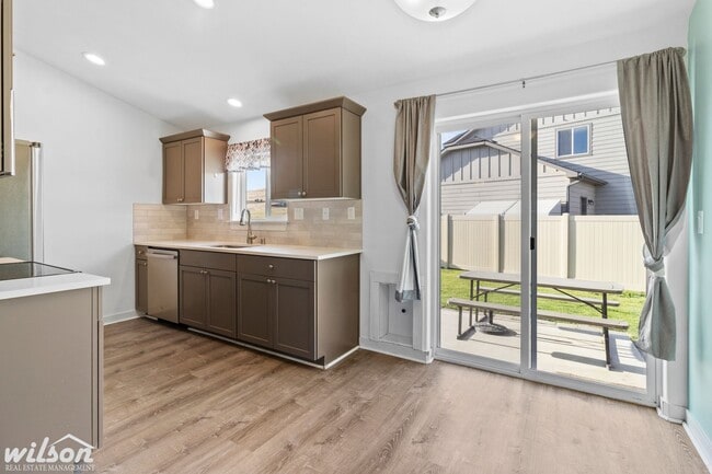 Building Photo - Welcome Home: Big Yard, Garage, and Pets A...