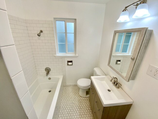 Building Photo - Beautiful Townhouse with Fenced Yard, Garage, and AC