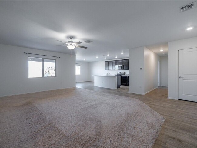 Building Photo - Spacious 4-Bedroom Home with Open Layout & Turf Backyard