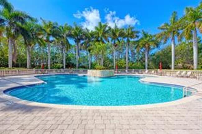 Building Photo - Elegant 3 Bedroom End-Unit Condo with Screened Lanai & Pond Views and A Private Garage