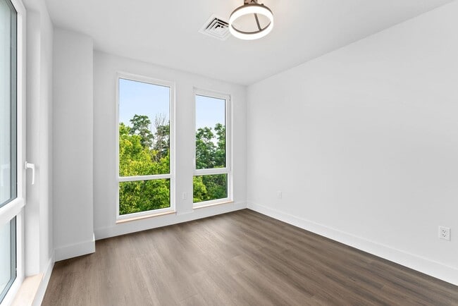 Building Photo - 2 Bedroom Corner-Unit with Wooded Balcony ...