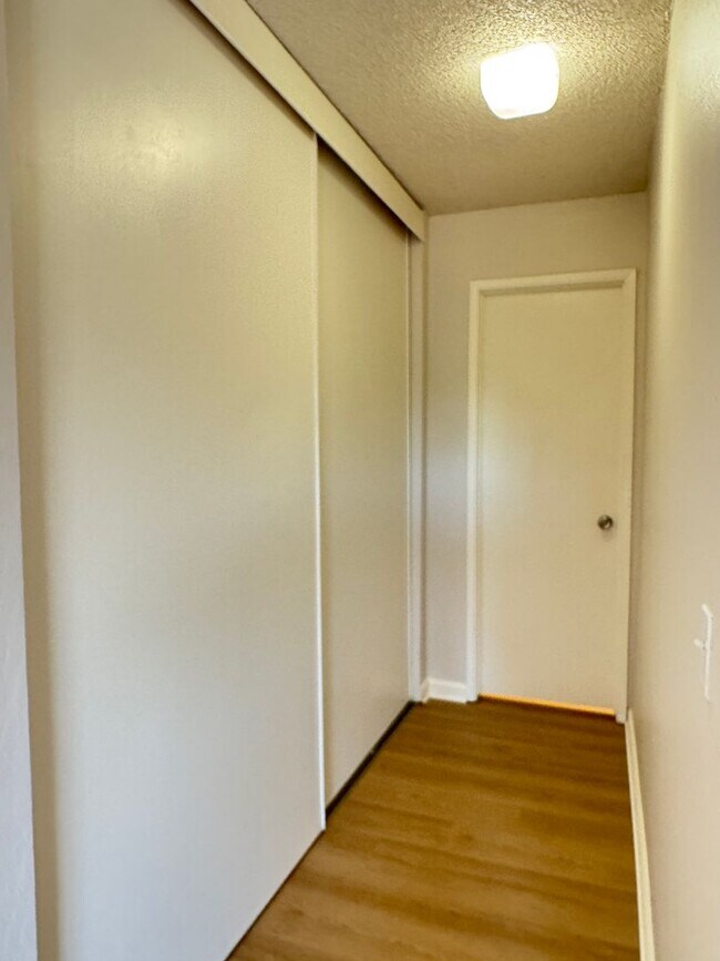 Building Photo - Welcome to this updated 3 bedroom condo with laminate vinyl plank flooring