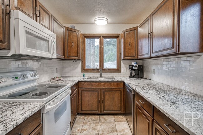 Building Photo - On the Blue River!  HUGE 4 Bedroom home, Furnished Updates throughout!  Bus route!  Spacious parking