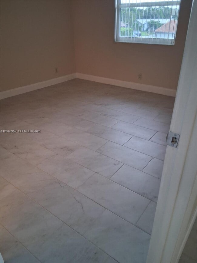 Building Photo - 10907 Royal Palm Blvd