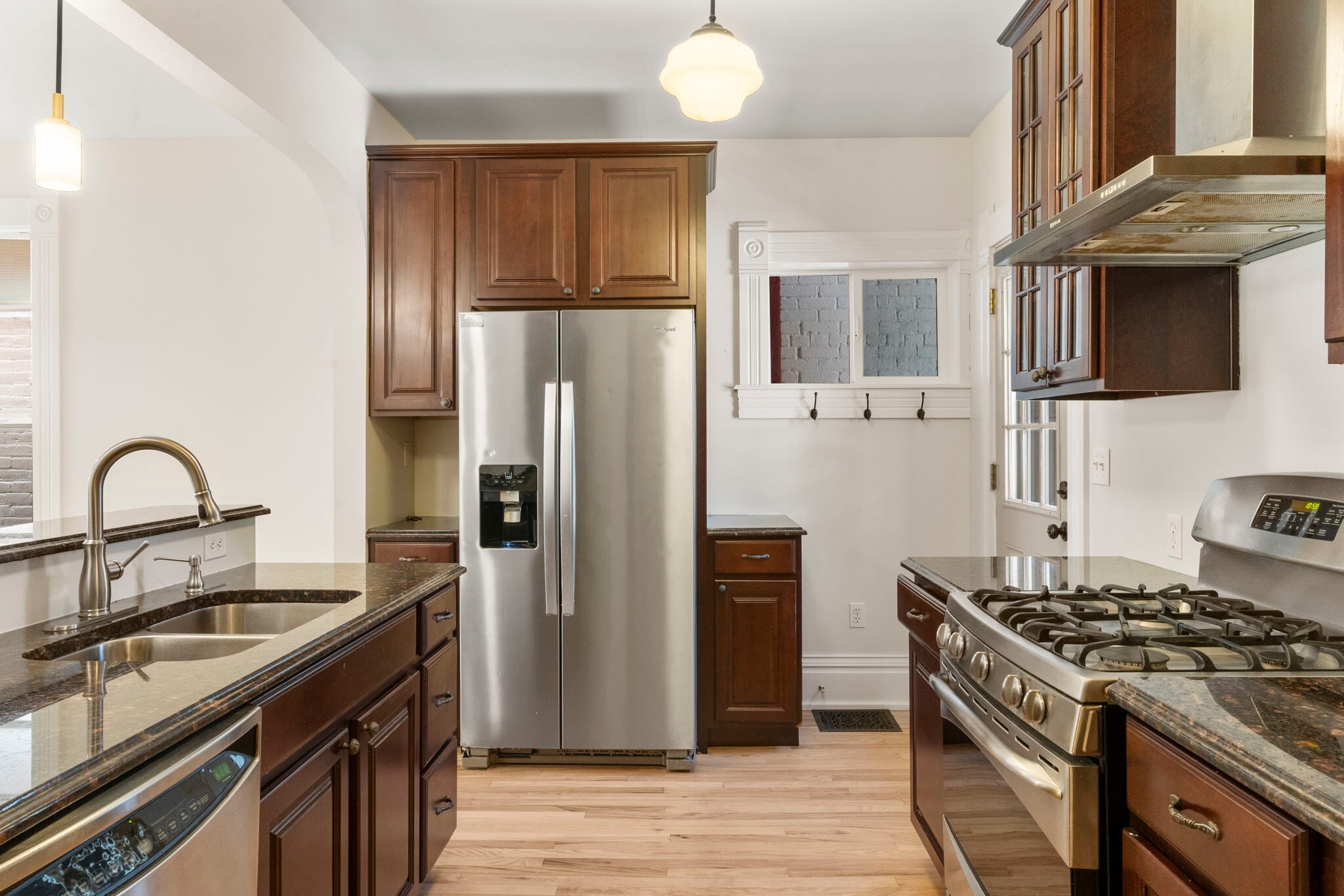 Stainless appliances with gas range and granite countertops. - 3347 Tejon St