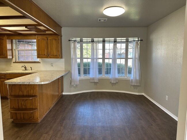 Building Photo - Clean, updated home on a corner lot with privacy fence and storage shed.