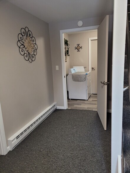 Foyer photo to laundry on first floor - 7 Callahan Dr
